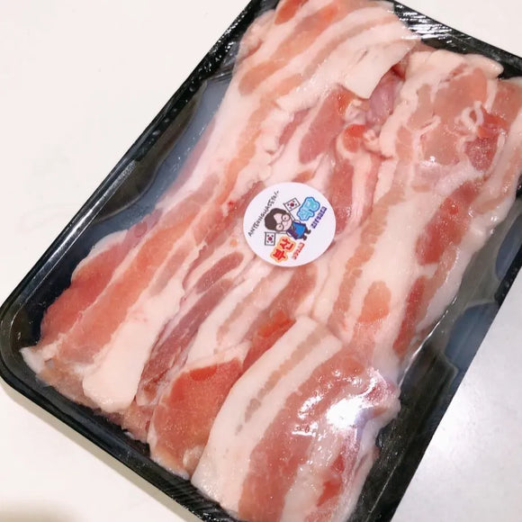 Packaged slices of Beef Belly, USDA raw meat with a visible brand label on a white background