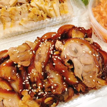 Roasted pork with sesame seeds on a white plate