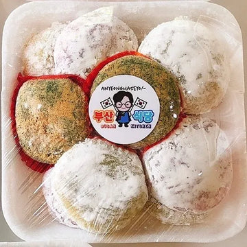 Packaged traditional Korean mochi with a visible brand label on a clear plastic tray.