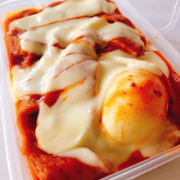 Image of a Cheesy Tteokbokki on a plastic container