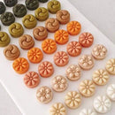 Assorted colorful Korean cookies on a white surface