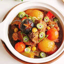 Stew with vegetables in a white bowl on a light background