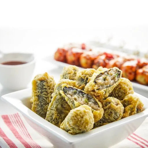 Fried gimmari in a white dish with a blurred background