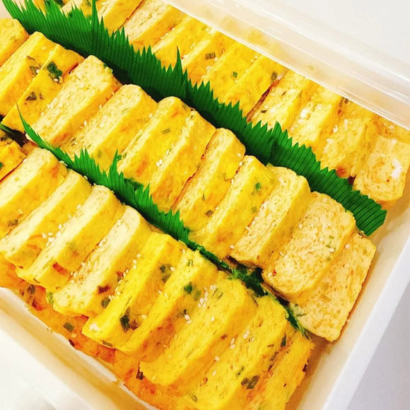 Gyeran Mari Platter with green garnish in a white container