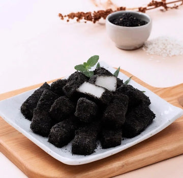 Black sweet rice cake in a white plate