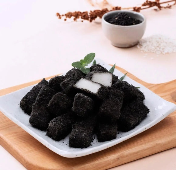 Black sweet rice cake in a white plate