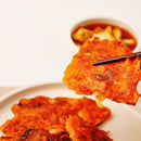 Kimchi pancakes on a plate with a blurred background