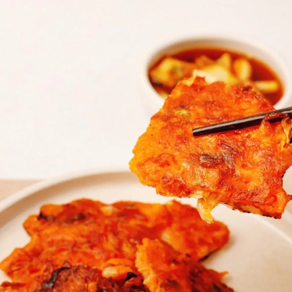 Kimchi pancakes on a plate with a blurred background