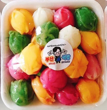 Colorful rice cakes in a box with a visible brand label.