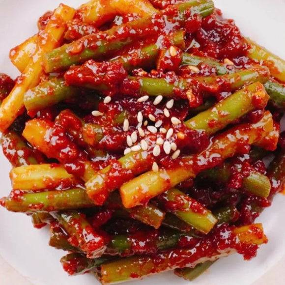 Spicy Seasoned Garlic Scrapes Banchan on a white plate