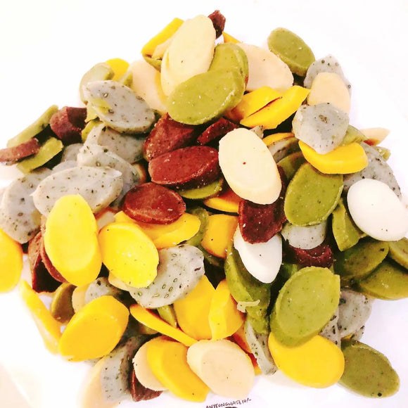 Colorful assortment of Osaek Tteoks on a white background