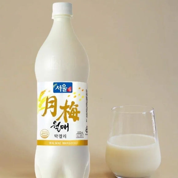 Bottle of Sooam brand milk with a glass on a beige background
