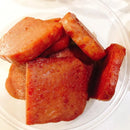 Close-up of sliced Korean spam on a white plate