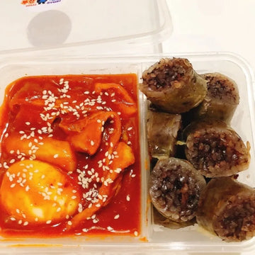 Plastic container with tteokbokki and pork blood sausage