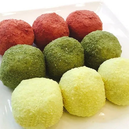 Gyeongdan. Colorful spherical rice cake on a white plate