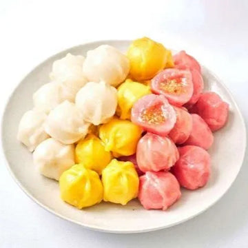 Special Kultteok. Assorted colorful dumplings on a white plate