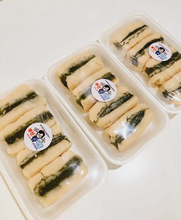 Three containers of Korean traditional Tteok, Ssuk-e.t with visible labels on a white background